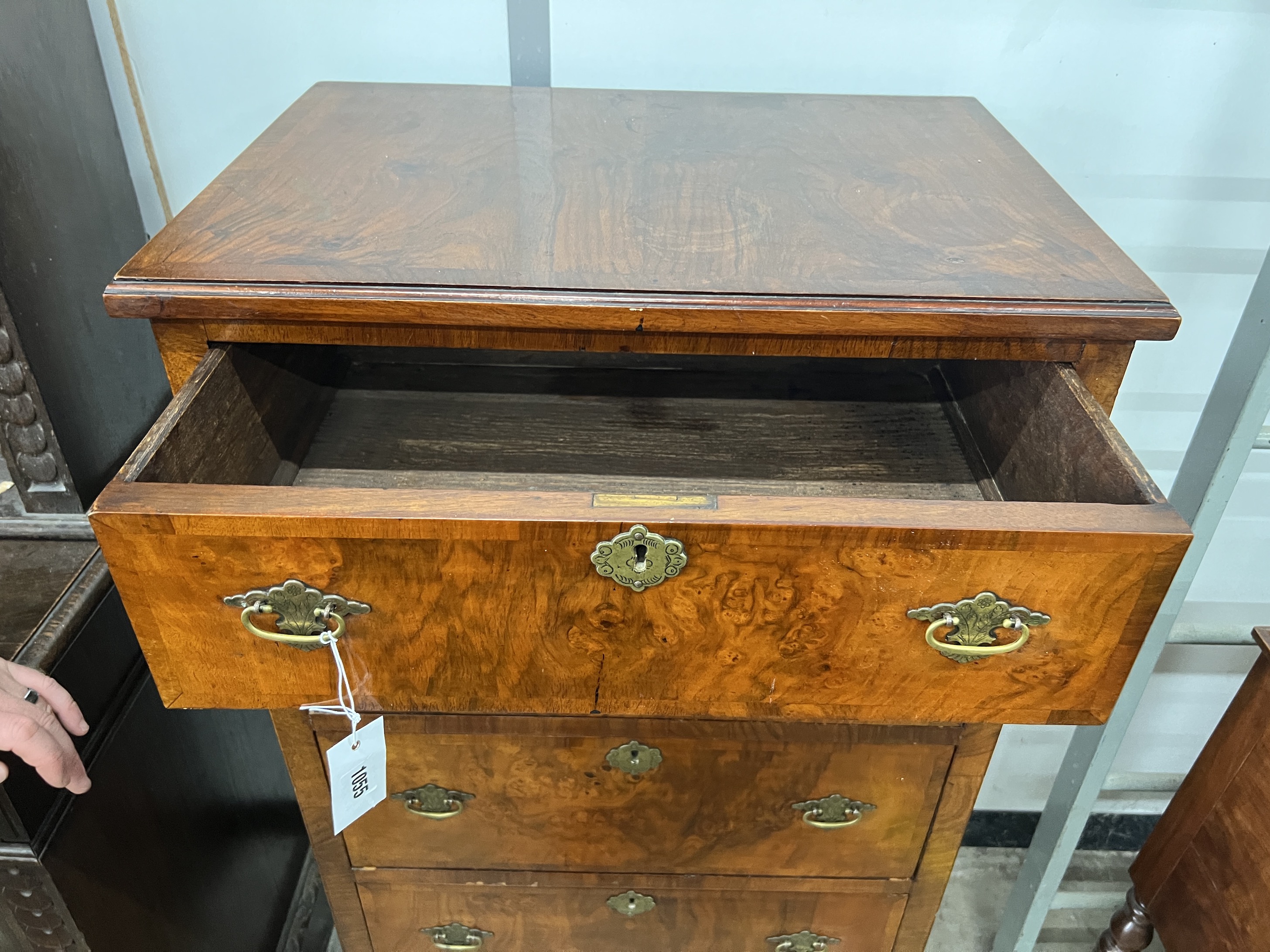 A Queen Anne revival narrow walnut five drawer chest, width 61cm, depth 42cm, height 122cm